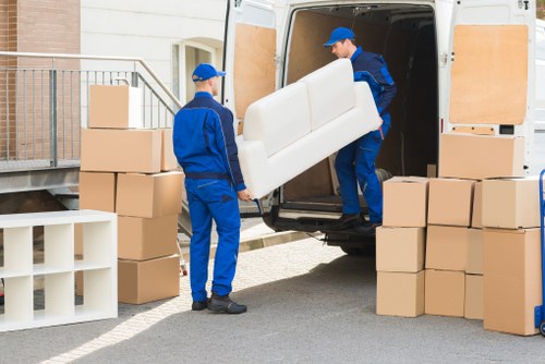 Professional flat removals in Edgware with moving boxes and van