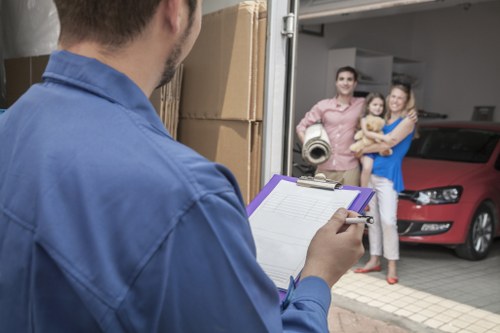 Packed household boxes and furniture prepared for a removals service in Edgware