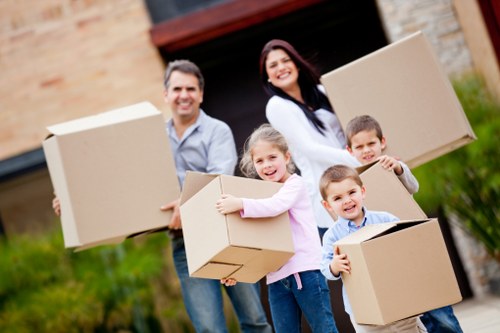 Professional house movers preparing boxes and furniture for transport in Edgware
