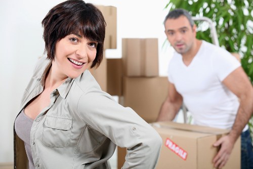 Packed moving boxes and furniture prepared for transport
