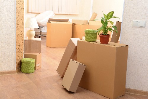 Professional movers handling stairs and access in a flat removal
