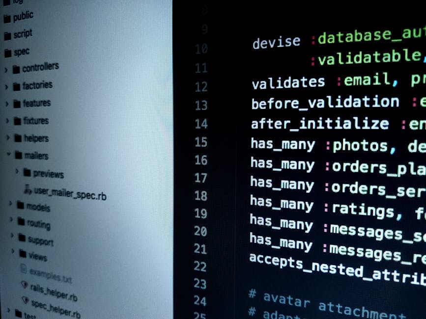 Close-up image of a computer screen displaying lines of colorful code with various programming elements highlighted in red, yellow, green, blue, and purple. The code appears to be part of a web develo